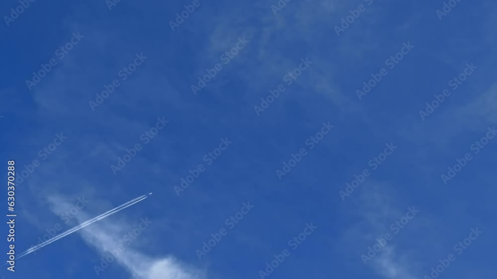 Jet contrail crossing the blue sky. Cloudscape, Japan. Jet contrail crossing the blue sky. Cloudscape, Japan.