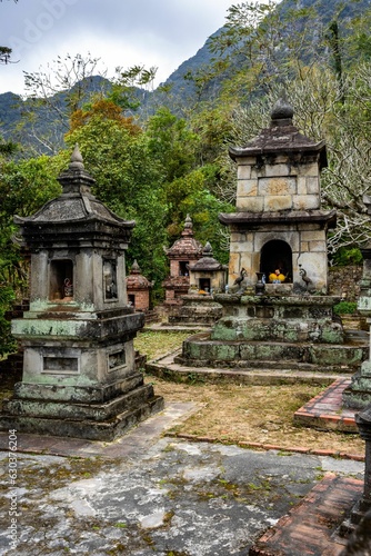 Asian Buddhist Temple and Shrine in Northeast Vietnam with Mountains in the Background © Joshua P Jacks/Wirestock Creators