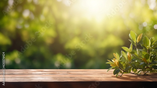 Beautiful spring background with green juicy young foliage and empty wooden table in nature outdoor © Chamli_Pr