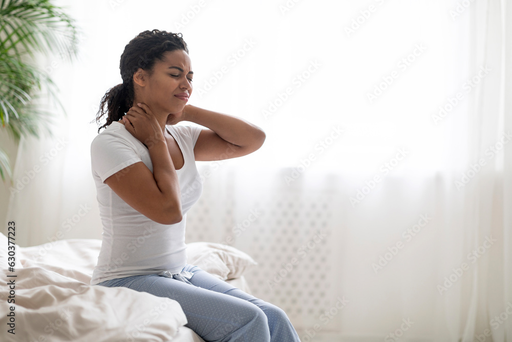Uncomfortable Bed. Black Man Waking Up With Neck Pain