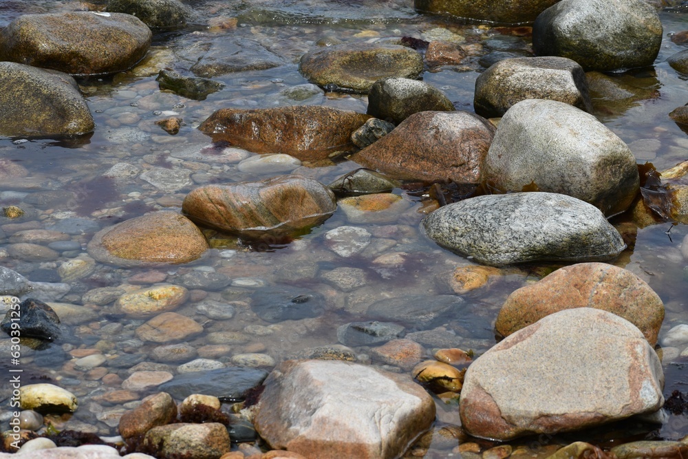 Tranquil stream meanders between the scatteredrocks Tranquil stream meanders between the scatteredrocks