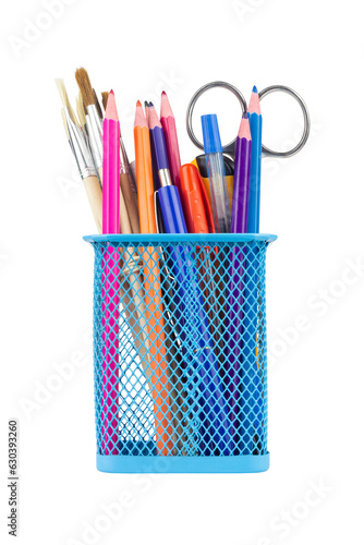 Colored pencils and various school supplies in a metal holder or cup. Isolated from the background