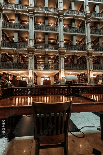 Interior view of a library featuring a bookshelf with rows of books