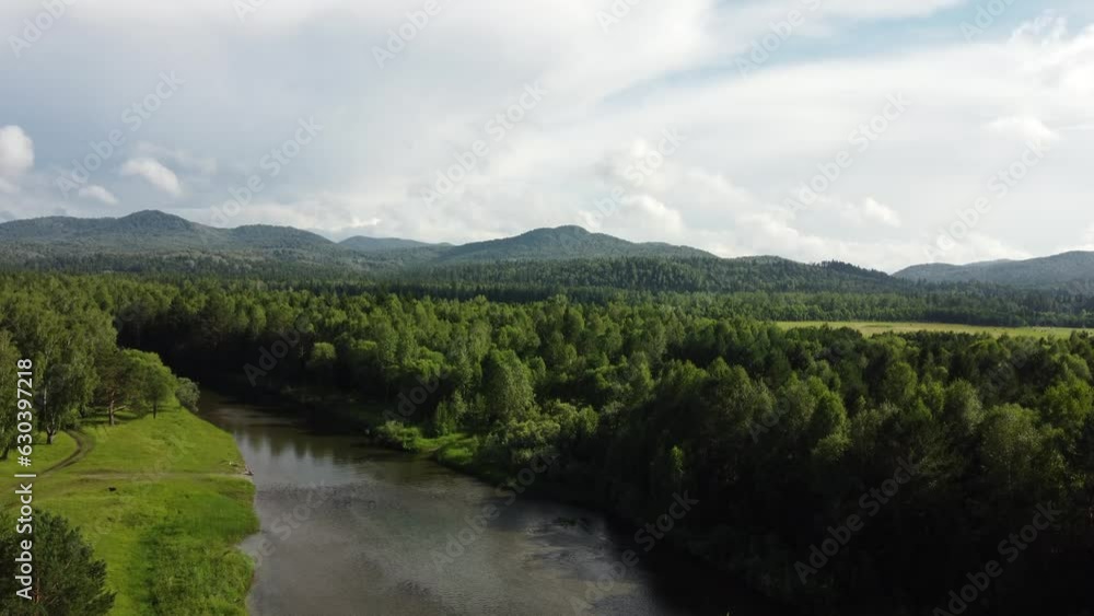 Aerial view of a river streaming through forest. Top view from drone, camera move toward. Forest, hills and river landscape Aerial view of a river streaming through forest. Top view from drone, camera move toward. Forest, hills and river landscape