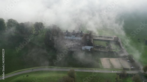 Aerial of the Waldegg Castle in Feldbrunnen-St. Niklaus, Switzerland on a foggy day photo