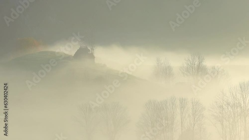 Beautiful view of green plains valley hills with colorful trees with hazy smoke