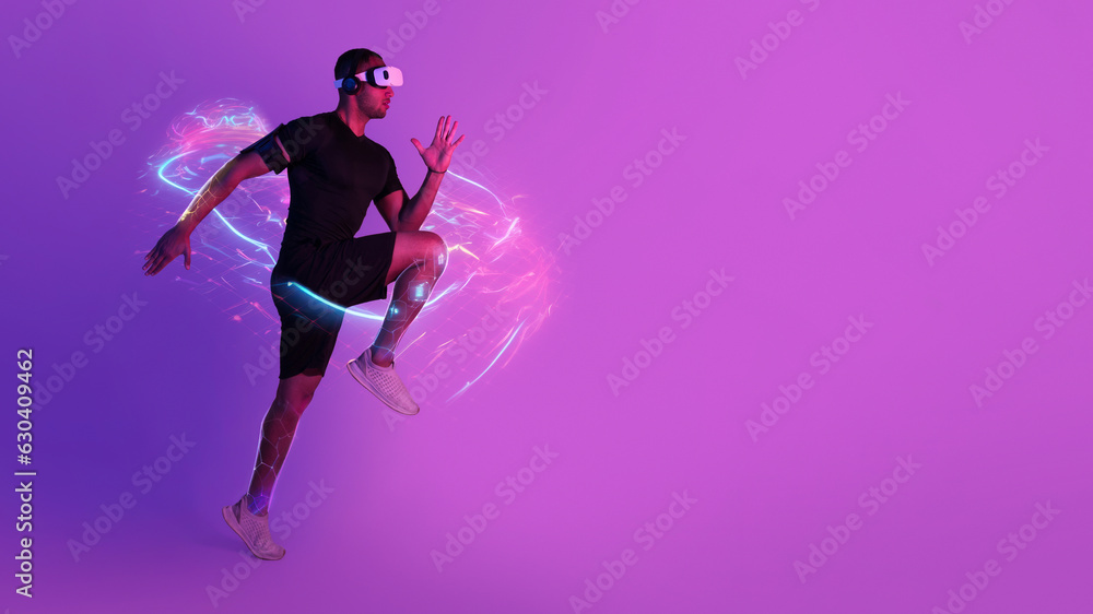 Sportsman running while wearing VR goggles, copy space