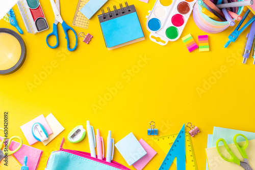 Wallpaper Mural School equipment high-colored bright yellow flat lay. Various school education and office supplies, accessories. Back to school sale background top view copy space Torontodigital.ca