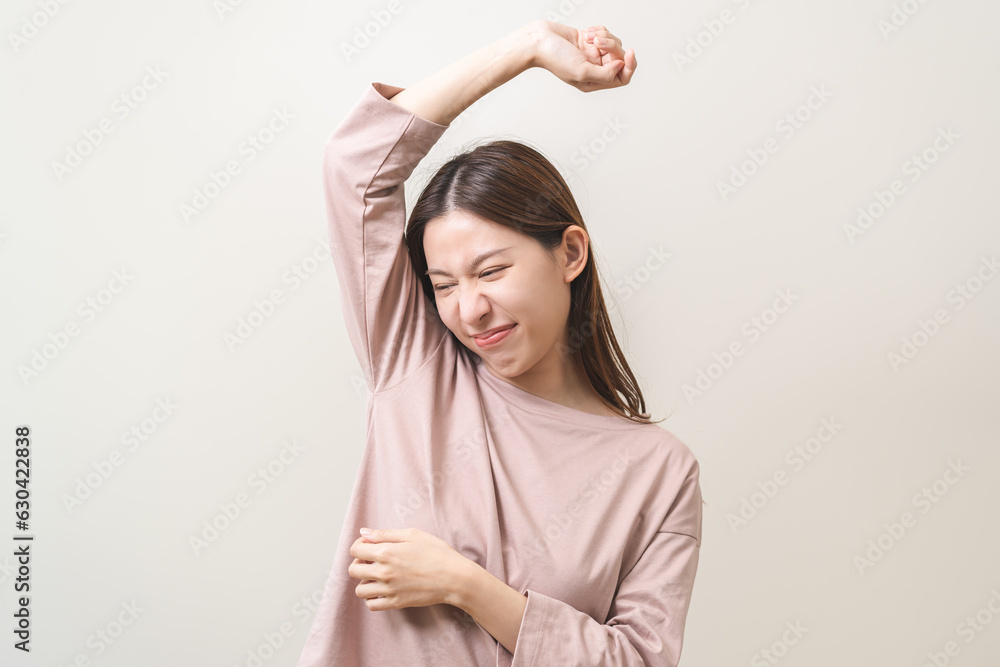 Bad smelling, deodorant asian young woman smell stink, breathing nose