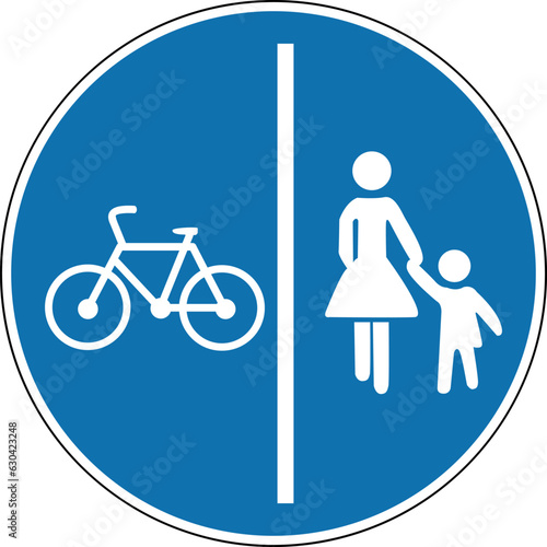 Pedestrian and bike path sign. Mandatory sign. Round blue sign. Separated path for cyclists and pedestrians. Road sign. Obey the rules of the road.