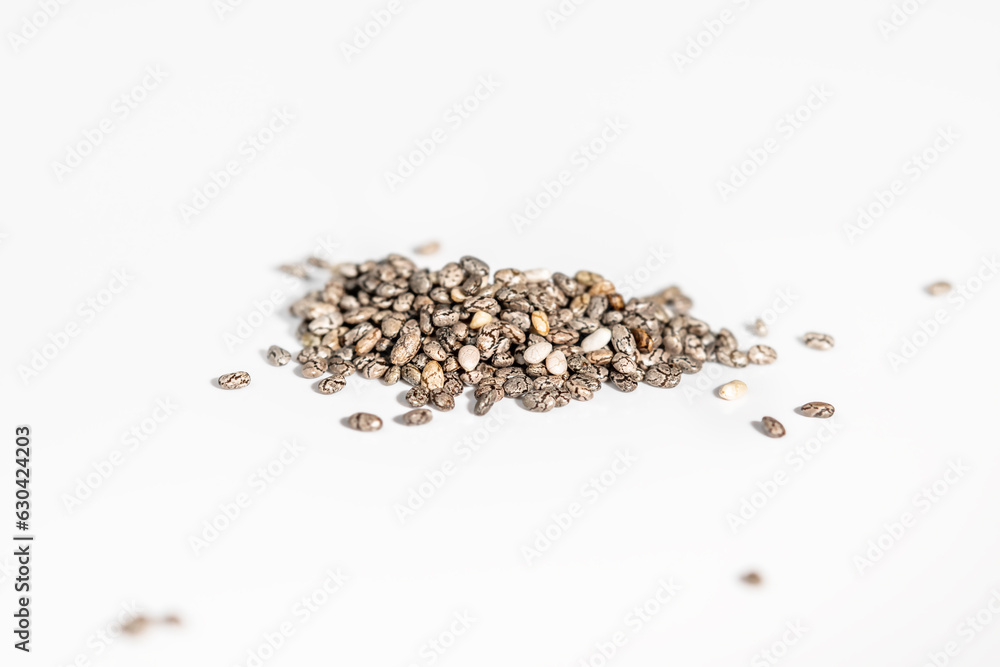 Pile of chia seeds, isolated on white, selecnive focuse. Pile of chia seeds, isolated on white, selecnive focuse.