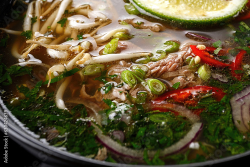 Fo-bo soup made of beef with spices and rice noodles photo