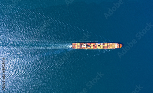 Top view Container ship full capacity approaching port International Container ship loading, unloading , Freight Transportation, Shipping,Logistics, import export, . Global transport business.