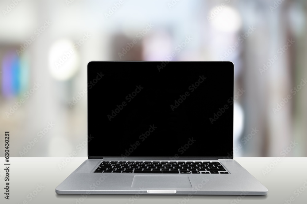 Laptop computer with a blank screen on the desk Laptop computer with a blank screen on the desk