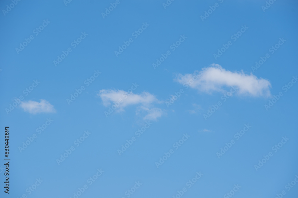 Clear blue sky and white clouds. White fluffy clouds in the blue sky. Beautiful white cloud on clear blue sky as nature concept . Clear blue sky and white clouds. White fluffy clouds in the blue sky. Beautiful white cloud on clear blue sky as nature concept .