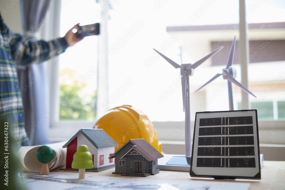 Image showcasing team of renewable energy engineers are talking to architects to make ...