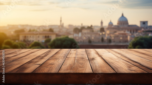 The empty wooden table top with blur background of Rome. Exuberant image. © Nataliia