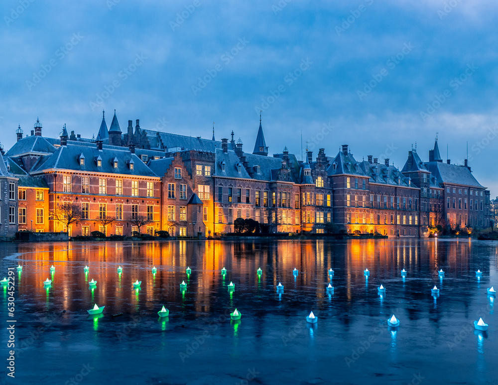 Fototapeta premium European Castle lit up at night. The Hague, Netherlands, during winter with a frozen pond.