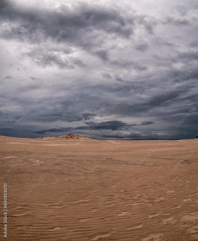 Beautiful scenery of moving sand dunes after thunderstorm