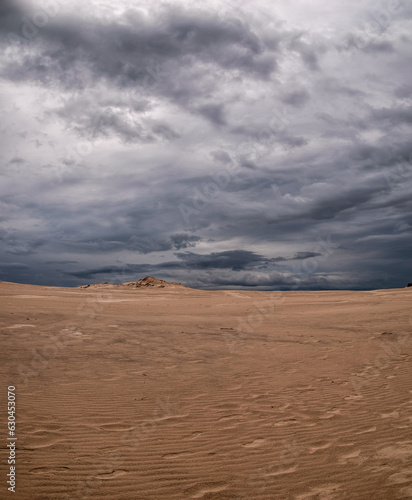Beautiful scenery of moving sand dunes after thunderstorm