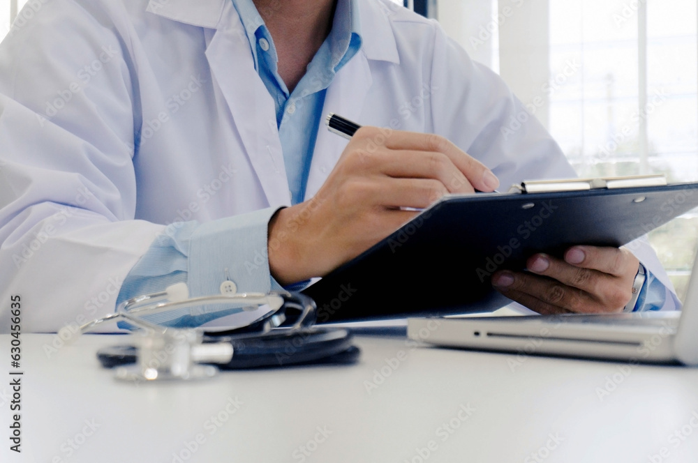 close up of patient and doctor taking notes or Professional medical doctor in white uniform gown coat interviewใ close up of patient and doctor taking notes or Professional medical doctor in white uniform gown coat interviewใ