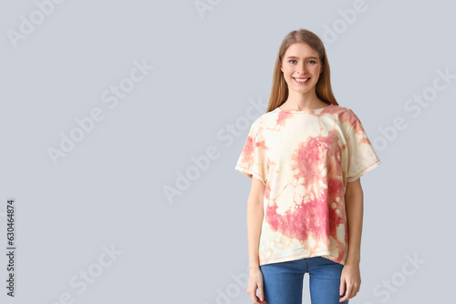 Young woman in tie-dye t-sh...