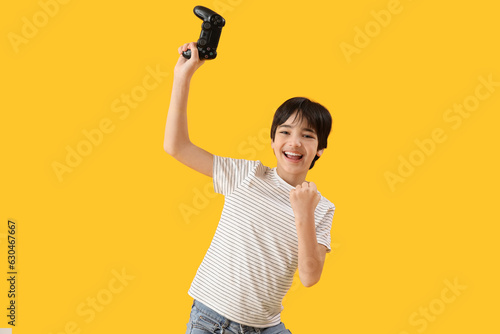 Happy little boy with game ...