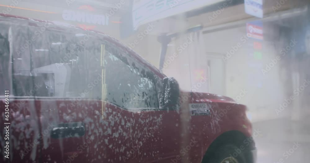 Car Wash Window View, Water Foam, Automatic Car Wash in Action. Modern