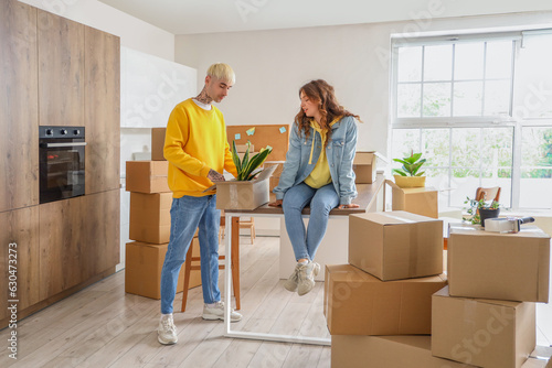Young couple moving into ne...