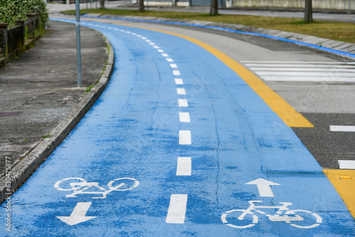 blue painted road bike lane cycling bicycle