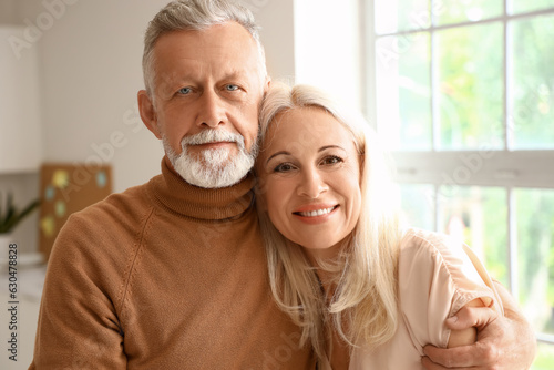 Happy mature couple hugging...