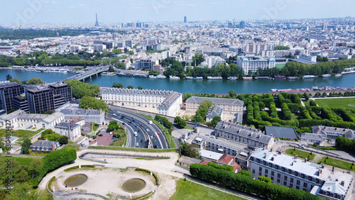 Bild auf Leinwand Drone point of view on Seine river, Boulgne-Billancourt and Eiffel tower in dist
