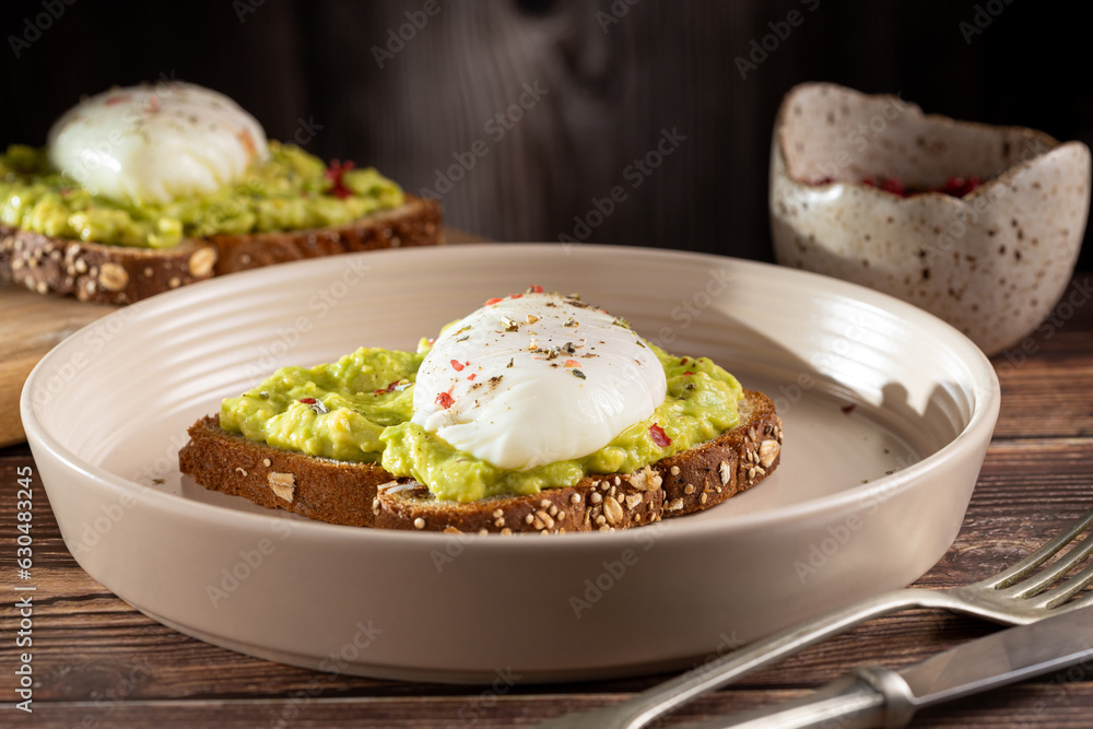 Wholemeal toast with avocado and poached egg.