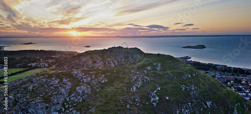 Aerial view of the whale bone monument on top North Berwick law in Scotland at sunset