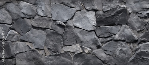 A high resolution top view image of a grey stone pattern on a concrete background, with copy space.