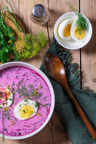Obraz na płótnie Traditional summer cold beetroot soup with cucumber, egg and sour cream on a wooden background. Rustic style. w salonie