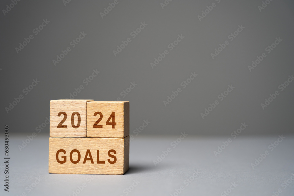 2024 goals concept. Planning strategy, plans and tasks. New business ideas. Setting goal, target. Motivation, inspiration. The inscription on wooden blocks 2024 goals concept. Planning strategy, plans and tasks. New business ideas. Setting goal, target. Motivation, inspiration. The inscription on wooden blocks