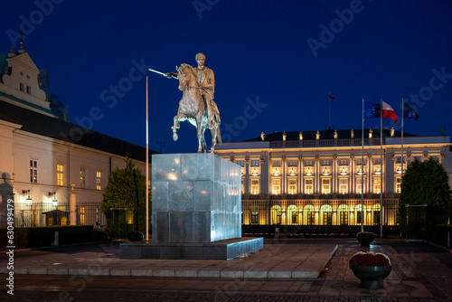 Presidential Palace illuminated at night with Monument of Józef Poniatowski, Warsaw, Poland
