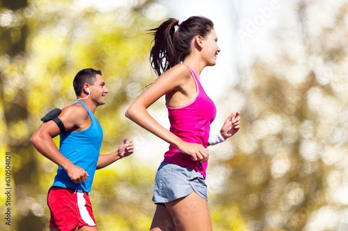 Happy young couple running together