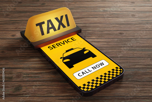 Taxi roof sign on a smart phone showing a taxi service app. Illustration of the concept of mobile taxi app photo