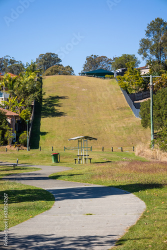 Photos A grassy easement for an underground water pipeline in a residential area on the