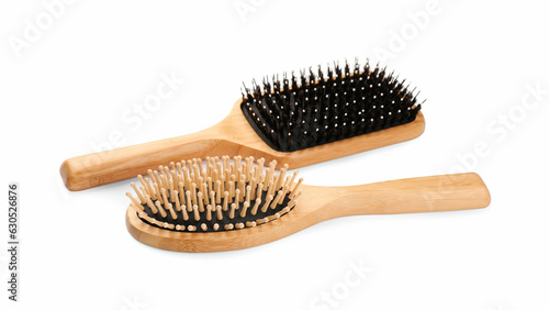 New wooden hair brushes isolated on white