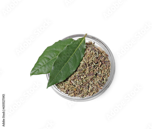 Bowl with different spices and fresh bay leaves on white background, top view
