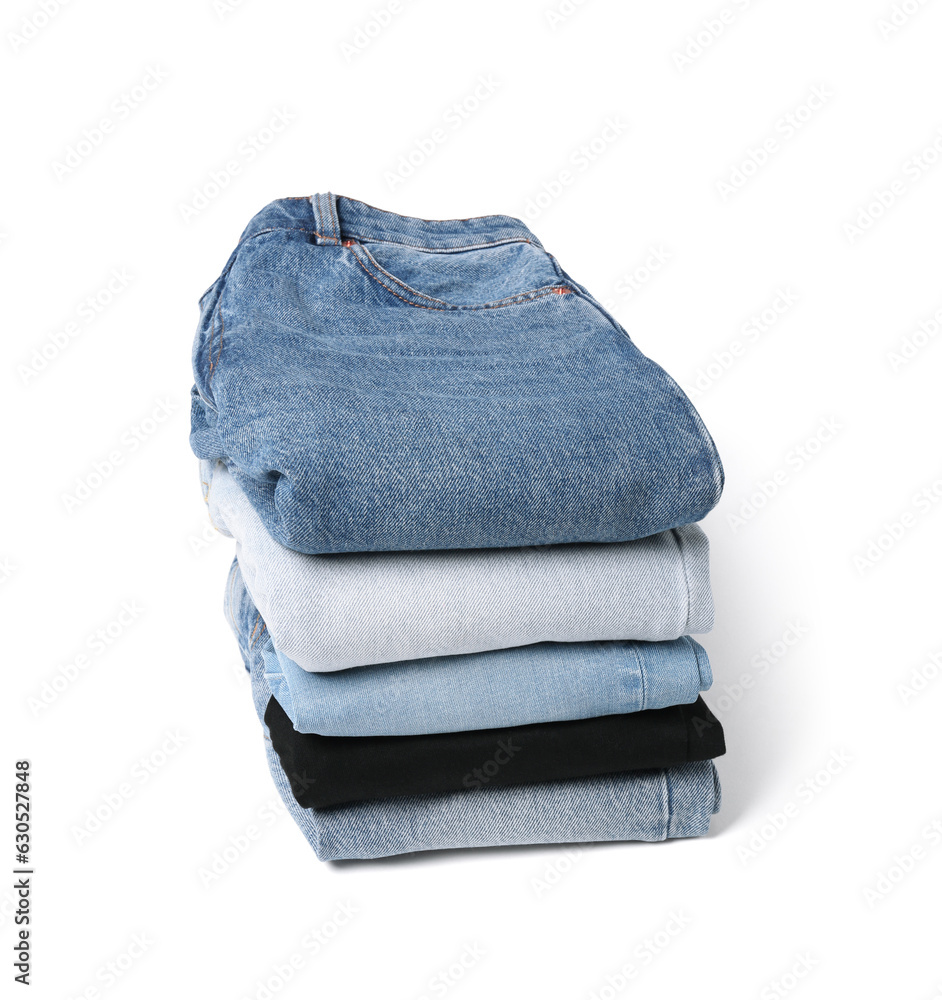 Stack of different folded jeans isolated on white Stack of different folded jeans isolated on white