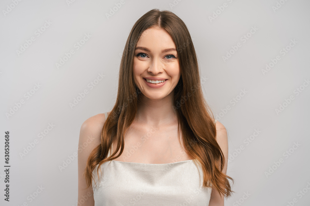 Portrait of beautiful smiling woman wearing nightgown looking at camera. Concept of health care Portrait of beautiful smiling woman wearing nightgown looking at camera. Concept of health care