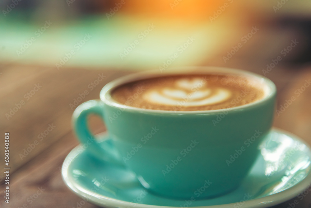 Latte art coffee cup with milk on wooden table. Espresso shot make latte art hot coffee cup. Cappuccino with milk in italian coffee shop cafe. Brown hot caffeine beverage in cafeteria with copy space Latte art coffee cup with milk on wooden table. Espresso shot make latte art hot coffee cup. Cappuccino with milk in italian coffee shop cafe. Brown hot caffeine beverage in cafeteria with copy space