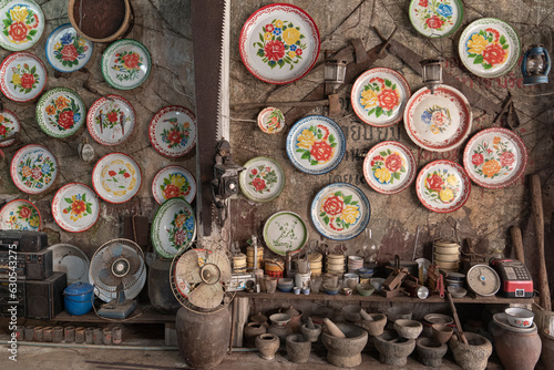 Antique shop in Takua Pa, Thailand. Old Chinese Plates, Mortars, and Household Items