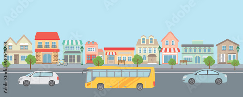 洋風な街並みを走る車とバス