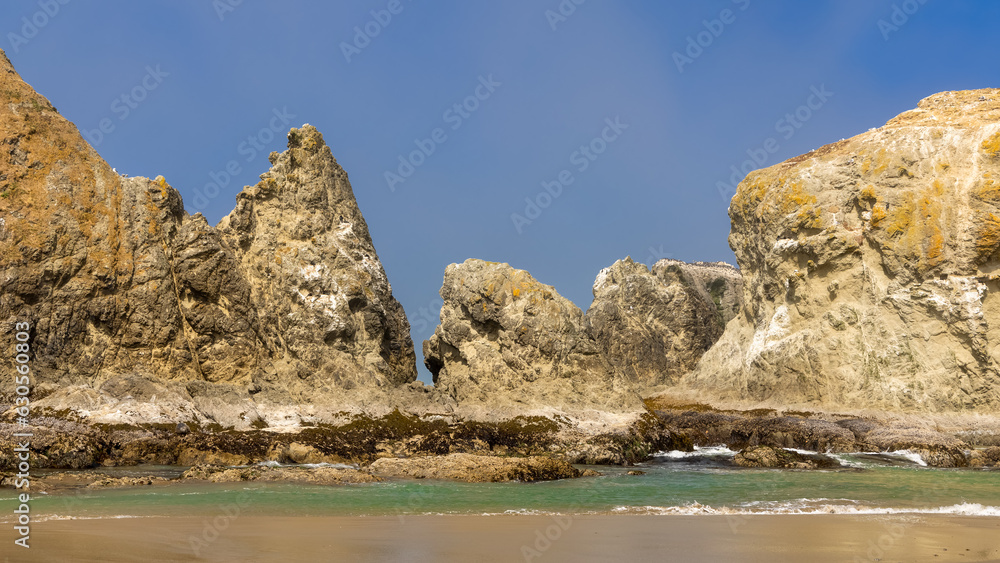 Close up view of Sea stacks along Oregon state coast , where colonies of shore birds nest . Close up view of Sea stacks along Oregon state coast , where colonies of shore birds nest .