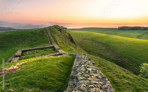Fototapete The view of the Milecastle 39 of the Hadrian's Wall in sunset hours